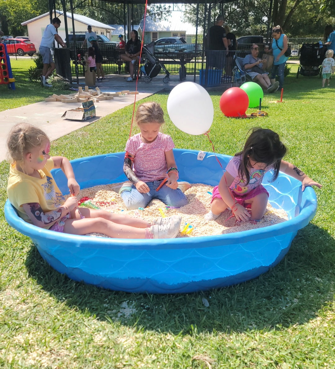 Kids digging through the kiddie pool at the Oatmeal Festival Oatmeal Dig